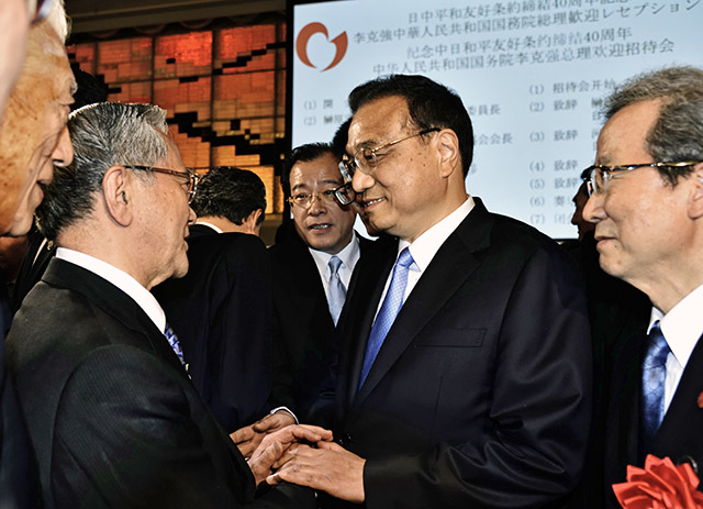 El presidente Harada y el primer ministro chino Li Keqiang